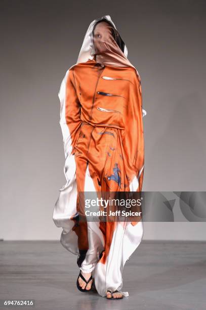Model walks the runway at the Alex Mullins show during the London Fashion Week Men's June 2017 collections on June 11, 2017 in London, England.
