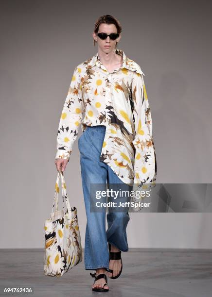 Model walks the runway at the Alex Mullins show during the London Fashion Week Men's June 2017 collections on June 11, 2017 in London, England.