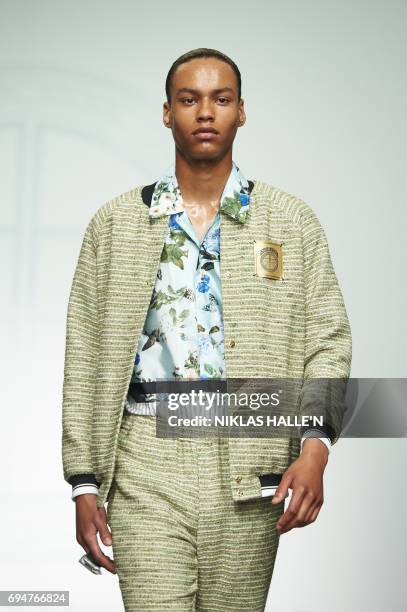 Model presents a creation by Danish-born designer Astrid Andersen during her catwalk show at London Fashion Week Men's June 2017 in London on June...