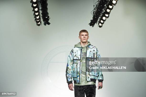 Model presents a creation by Danish-born designer Astrid Andersen during her catwalk show at London Fashion Week Men's June 2017 in London on June...