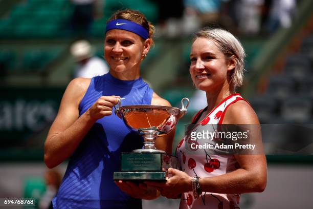 Lucie Safarova of The Czech Republic and partner Bethanie Mattek-Sands of The United States celebrate victory with the trophy following the ladies...