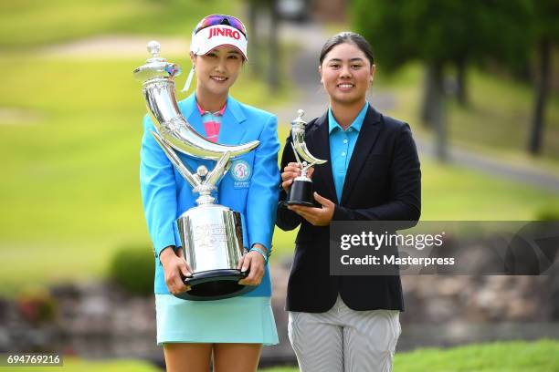 Ha-Neul Kim of South Korea and Yuka Saso of Philippines poses with the trophy after winning the Suntory Ladies Open at the Rokko Kokusai Golf Club on...