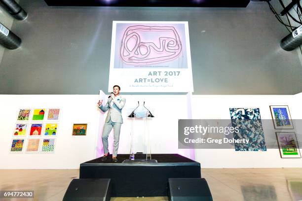 Auctioneer Gabriel Butu conducts the live auction at the Angel Art Fundraiser Hosted by Project Angel Food at NeueHouse Los Angeles on June 10, 2017...