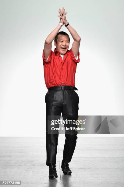 Designer Arashi Yanagawa appears on the runway following the runway at the John Lawrence Sullivan show during the London Fashion Week Men's June 2017...