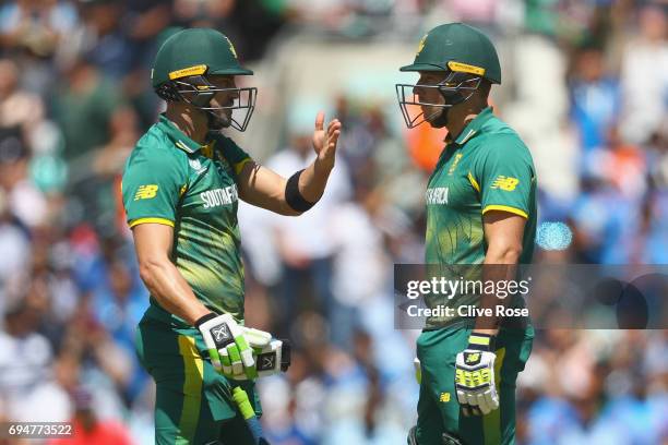 Faf du Plessis and David Miller of South Africa look on after the running out David Miller during the ICC Champions trophy cricket match between...