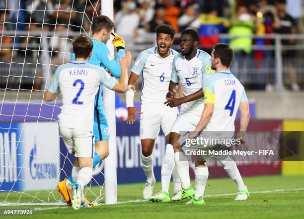 Goalkeeper Freddie Woodman of England is congratulated as he saves a penalty from Adalberto Penaranda of Venezuela during the FIFA U-20 World Cup...