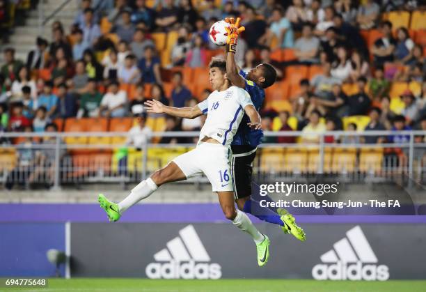 Dominic Calvert-Lewin of England jumps with goalkeeper Wuilker Farinez of Venezuela during the FIFA U-20 World Cup Korea Republic 2017 Final between...