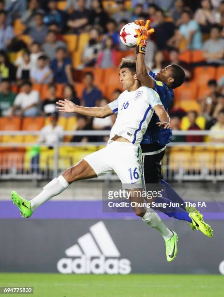 Dominic Calvert-Lewin of England jumps with goalkeeper Wuilker Farinez of Venezuela during the FIFA U-20 World Cup Korea Republic 2017 Final between...