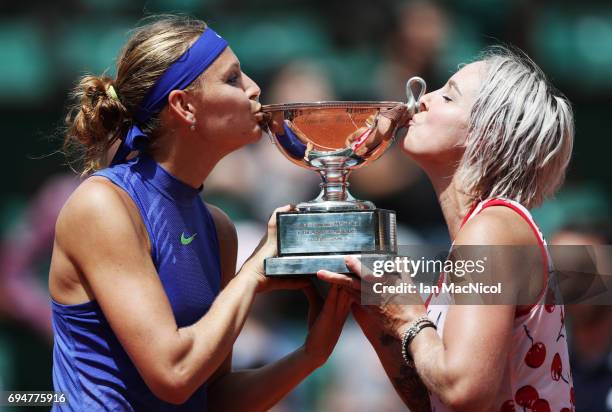 Bethany Mattek-Sands of United States and Lucie Safarova of Czech Republic pose with the trophy after their victory over Ashleigh Barty and Casey...