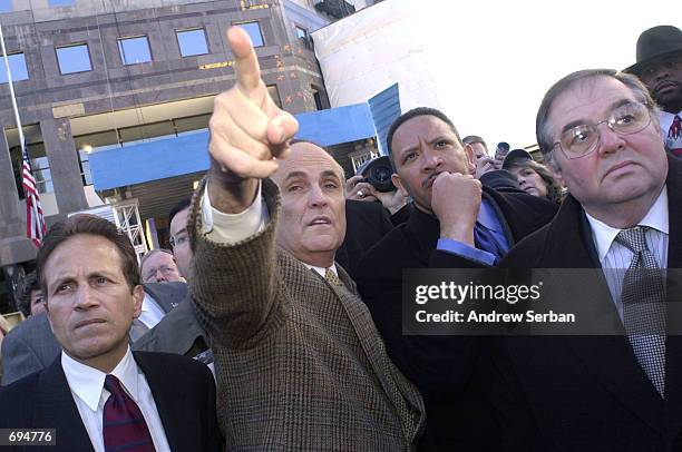 Former New York City Mayor Rudolph Giuliani gestures as he makes a comment about the remains of the former World Trade Center site, now known as as...