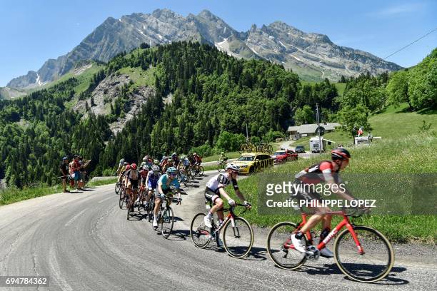The pack rides during the 115 km eighth stage of the 69th edition of the Criterium du Dauphine cycling race on June 11, 2017 between Albertville and...