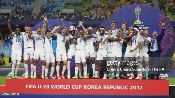 Captain Lewis Cook of England lifts the trophy in victory with team mates after the FIFA U-20 World Cup Korea Republic 2017 Final between Venezuela...