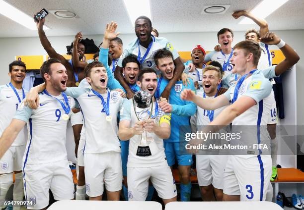 England players celebrate victory with the trophy in the dressing room after the FIFA U-20 World Cup Korea Republic 2017 Final between Venezuela and...