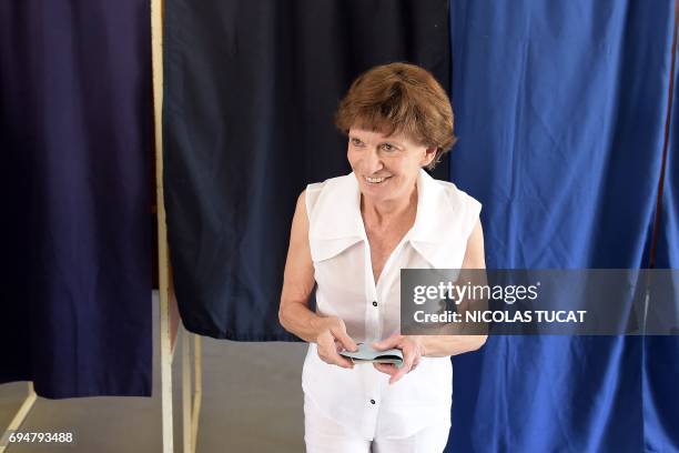 Michele Delaunay, Socialist Party candidate in the 2nd constituency of Gironde, leaves a voting booth at a polling station in Bordeaux, southwestern...