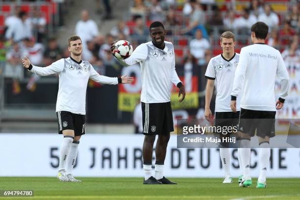 Timo Werner , Antonio Ruediger, Matthias Ginter and Sebastian Rudy of Germany warm up prior to the FIFA 2018 World Cup Qualifier between Germany and...