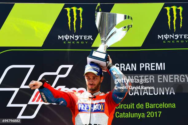 Andrea Dovizioso of Italy and Ducati Team celebrates on the podium after winning the MotoGp of Catalunya at Circuit de Catalunya on June 11, 2017 in...