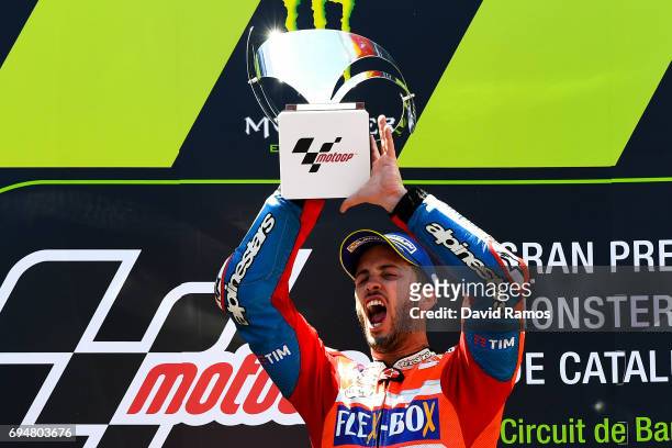 Andrea Dovizioso of Italy and Ducati Team celebrates on the podium after winning the MotoGp of Catalunya at Circuit de Catalunya on June 11, 2017 in...