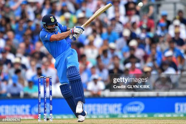 India's captain Virat Kohli plays a shot during the ICC Champions Trophy match between South Africa and India at The Oval in London on June 11, 2017....