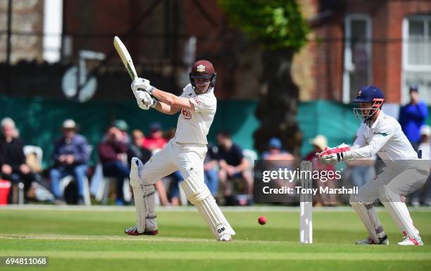 Rory Burns of Surrey bats during the Specsavers County Championship: Division One match between Surrey and Essex at Guildford Cricket Club on June...