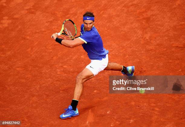 Rafael Nadal of Spain plays a backhand during the mens singles final match against Stan Wawrinka of Switzerland on day fifteen of the 2017 French...
