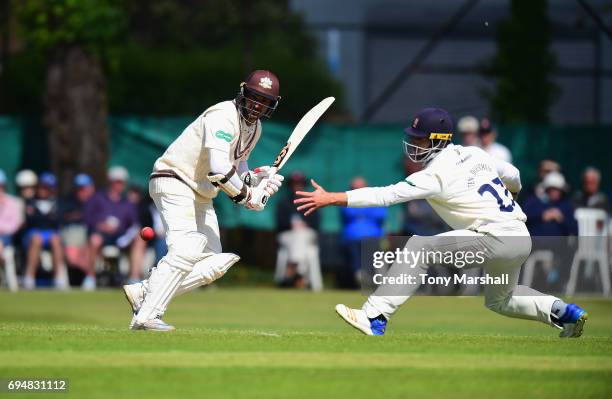 Ryan ten Doeschate of Essex stretches to reach the ball off the shot by by Kumar Sangakkara of Surrey during the Specsavers County Championship:...