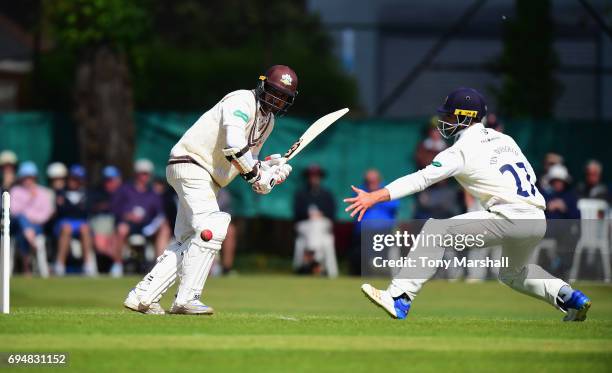 Ryan ten Doeschate of Essex stretches to reach the ball off the shot by by Kumar Sangakkara of Surrey during the Specsavers County Championship:...