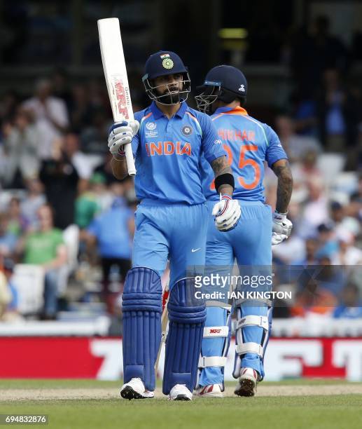 India's captain Virat Kohli reacts to reaching 50 during the ICC Champions Trophy match between South Africa and India at The Oval in London on June...