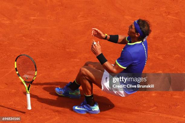 Rafael Nadal of Spain celebrates match point and victory during the men's singles final against Stan Wawrinka of Switzerland on day fifteen of the...