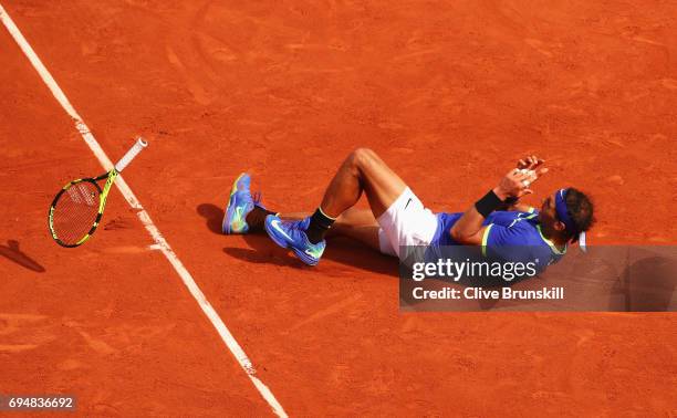 Rafael Nadal of Spain celebrates match point and victory during the men's singles final against Stan Wawrinka of Switzerland on day fifteen of the...