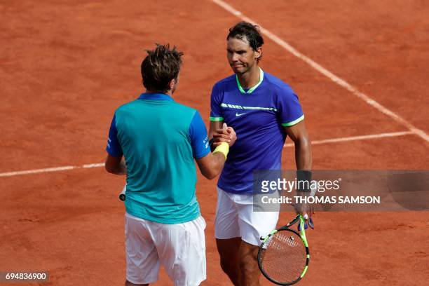 Spain's Rafael Nadal shakes hands with Switzerland's Stanislas Wawrinka after winning the men's final tennis match at the Roland Garros 2017 French...