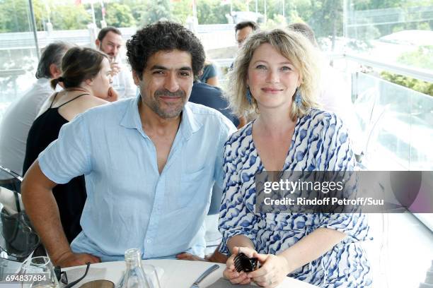 Actors Actors Abdelhafid Metalsi and Cecile Bois attend the Men Final of the 2017 French Tennis Open - Day Fithteen at Roland Garros on June 11, 2017...