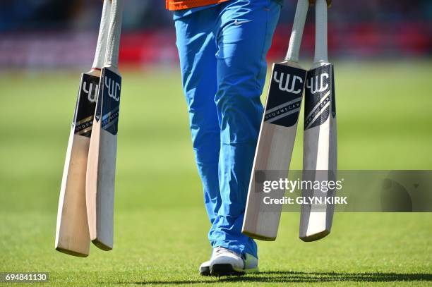 Selection of bats are brought out for India's Yuvraj Singh during the ICC Champions Trophy match between South Africa and India at The Oval in London...