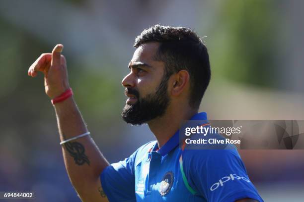 Virat Kohli of India celebrates as he leaves the field after the ICC Champions trophy cricket match between India and South Africa at The Oval in...