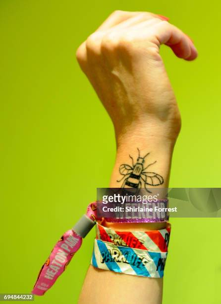 Photographer's own Love Manchester bee tattoo by artist Cathy Santos with wristband accreditation to Parklife Festival 2017 at Heaton Park on June...