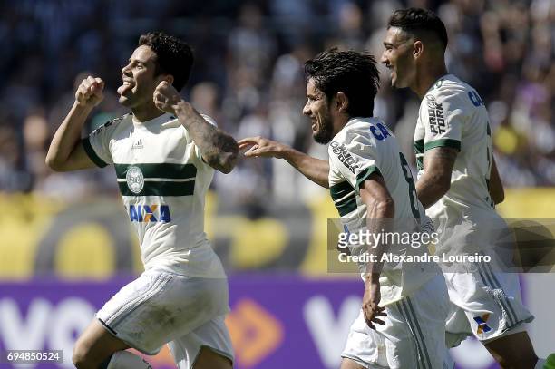 Henrique Almeida of Coritiba celebrates a scored goal with Tiago Real and DodÃ´ during the match between Botafogo and Coritiba as part of Brasileirao...
