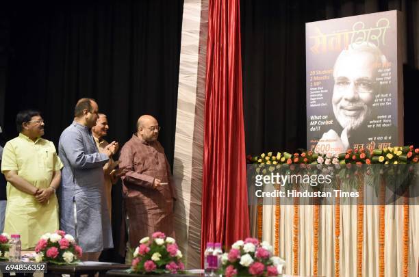 National President Amit Shah with Dr. Bajranglal Gupta, RSS ideologue, BJP National Vice President Shyam Jaju, East Delhi MP Mahesh Girri during the...