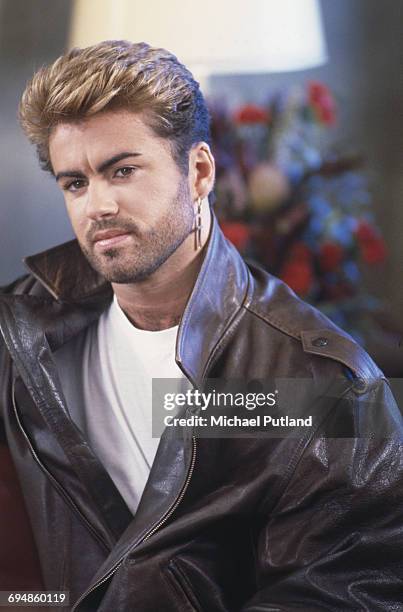 English singer and songwriter George Michael pictured wearing a leather jacket during the Japanese/Australasian leg of his Faith World Tour,...