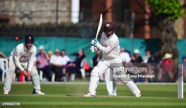 Sam Curran of Surrey bats during the Specsavers County Championship: Division One match between Surrey and Essex at Guildford Cricket Club on June...
