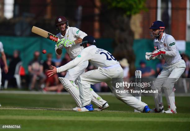 Ben Foakes of Surrey hits his shot past Dan Lawrence of Essex during the Specsavers County Championship: Division One match between Surrey and Essex...