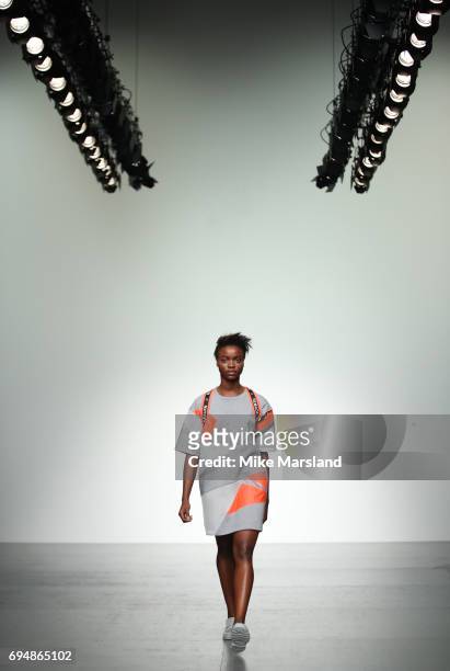 Model walks the runway at the Christopher Raeburn show during the London Fashion Week Men's June 2017 collections on June 11, 2017 in London, England.