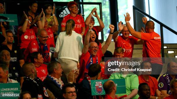 Club members of 1. FC Rielasingen-Arlen celebrate after being chosen Borussia Dortmund in the first round during the DFB Cup Draw at Deutsches...