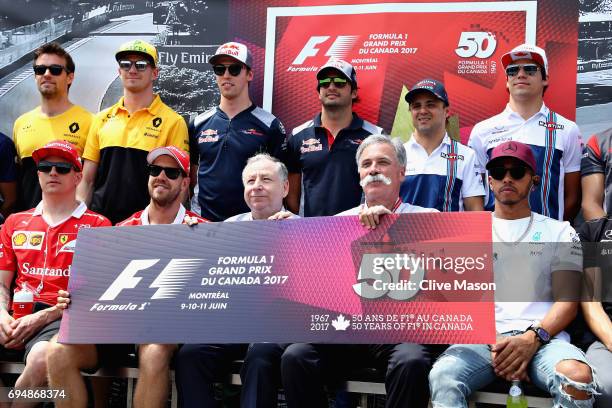 The F1 drivers and leadership stand together to celebrate 50 years of the Canadian Grand Prix during the Canadian Formula One Grand Prix at Circuit...