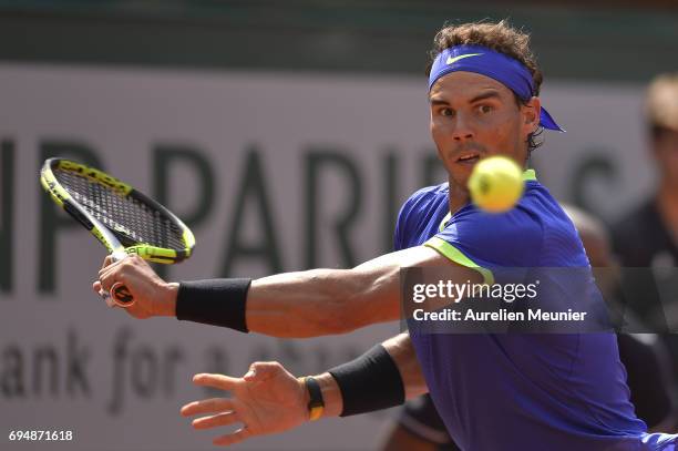 Rafael Nadal of Spain plays a backhand during the men's single final match against Stan Wawrinka of Switzerland on day fifteen of the 2017 French...