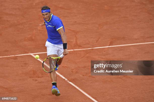 Rafael Nadal of Spain plays a backhand during the men's single final match against Stan Wawrinka of Switzerland on day fifteen of the 2017 French...