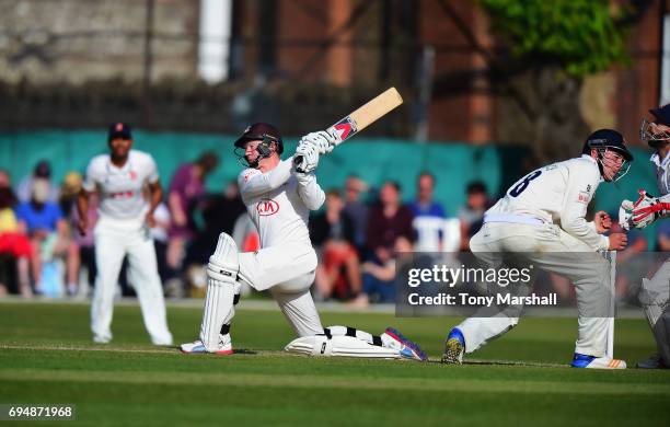 Gareth Batty of Surrey bats during the Specsavers County Championship: Division One match between Surrey and Essex at Guildford Cricket Club on June...