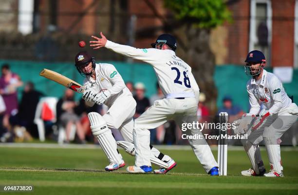 Gareth Batty of Surrey hits his shot past Dan Lawrence of Essex during the Specsavers County Championship: Division One match between Surrey and...