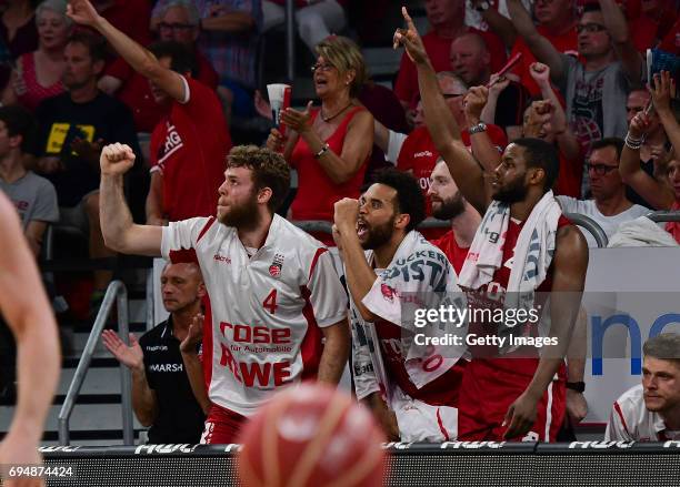 Nicolo Melli, Elias Harris and Darius Miller of Bamberg celebrate a succefull three-point-shot during game 3 of the 2017 BBL Finals at Brose Arena on...