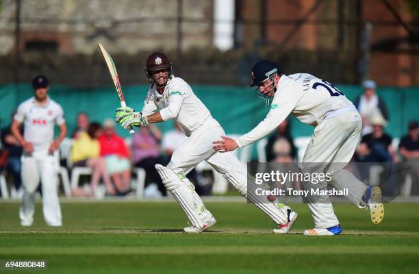 Ben Foakes of Surrey hits his shot past Dan Lawrence of Essex during the Specsavers County Championship: Division One match between Surrey and Essex...