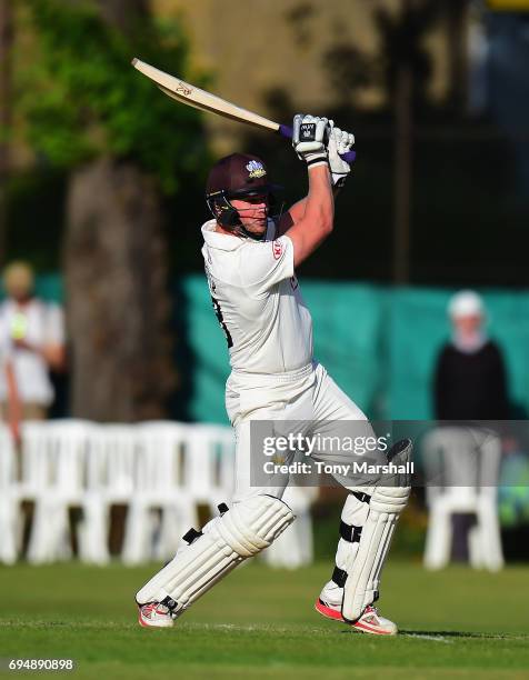 Stuart Meaker of Surrey bats during the Specsavers County Championship: Division One match between Surrey and Essex at Guildford Cricket Club on June...