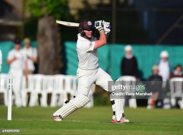 Stuart Meaker of Surrey bats during the Specsavers County Championship: Division One match between Surrey and Essex at Guildford Cricket Club on June...